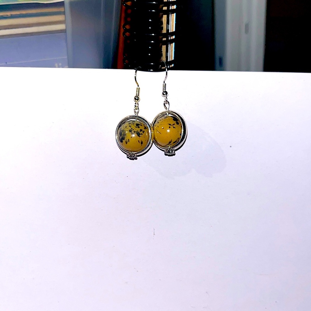 Silver dangly earrings. With brown beads